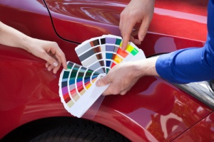 man deciding on color of custom paint job