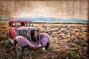 an old red rusted truck that needs to be restored