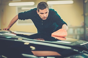 a man working on a car roof