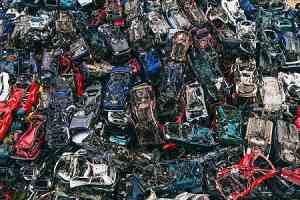 Pile of scrapped cars. Safety regulations for classic car restorations concept