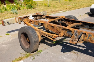 old rusty truck frame with shock absorber needing a truck frame repair