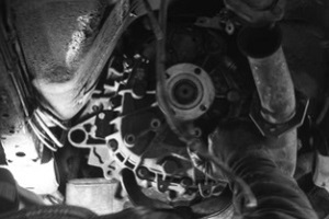 mechanic fixing car engine problems