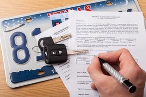 Signing car insurance papers